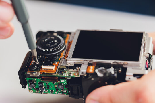 Repairing digital single lens reflex camera, isolated.