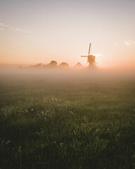 windmill in the morning-mist in holland © Teun