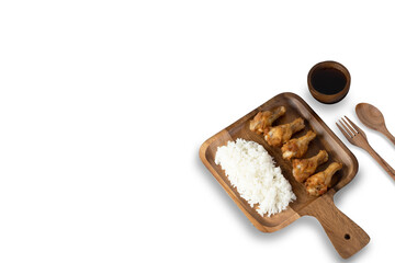 Fried chicken wings and dipping sauce Served with rice on a wooden plate on a white background in the top view, with a copying area for  food concepts