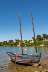 Fototapeta premium Brittany, Ile aux Moines island in the Morbihan gulf, the typical harbor and an old traditional boat 