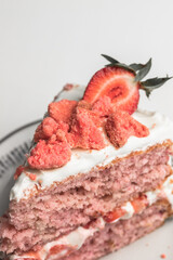 Strawberry cake dessert with fresh cut strawberries on the top for garnish. two layer pink colored cake with white frosting. naked cake style - 364548494