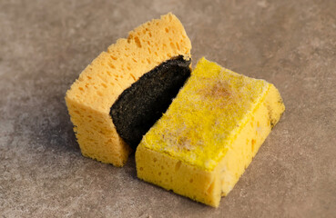 Old dirty cleaning sponges on gray background