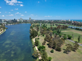 Aerial view of a beautiful sunny day at the Albert Park and Lake, with the golf course and Melbourne Skyline