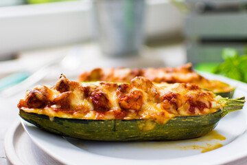 Zucchini stuffed with fresh tomatoes, tomato sauce, gouda cheese and mozzarella cheese.