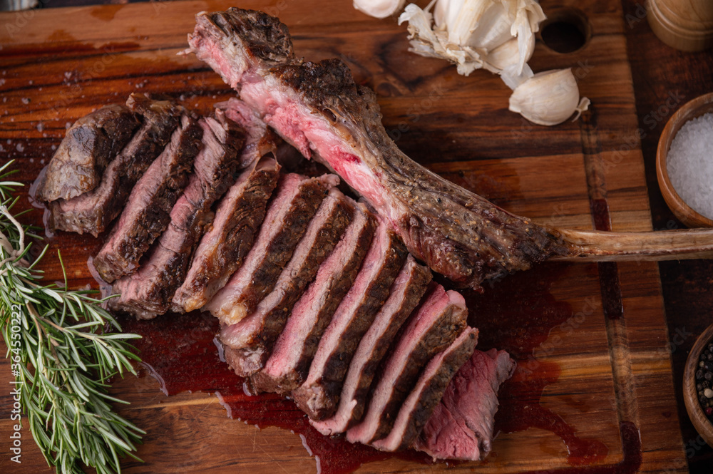 Poster grilled tomahawk steak on wooden board