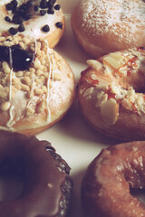 Assorted donuts with different fillings in cardboard box