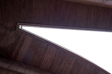 Fork of a viaduct in reddish color, photographed from below with a wide angle. Stuttgart.