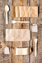 food delivery workdesk with paper bags and flatware table background top view mock-up