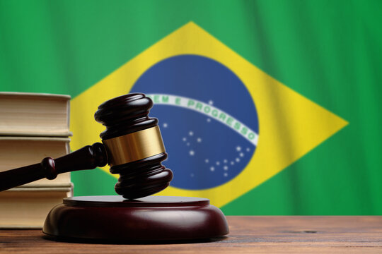 Justice and court concept in Federative Republic of Brazil. Judge hammer on a flag background