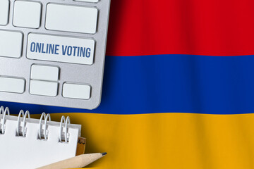 Online voting concept in Republic of Armenia. Keyboard near country flag.