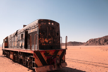 Old Ottoman steam locomotive in the desert of Wadi Rum, Jordan - historical relic of the Hejaz...
