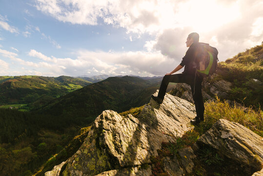 Traveling woman admiring mountainous landscape