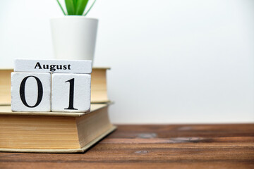 1st august - first day month calendar concept on wooden blocks with copy space.