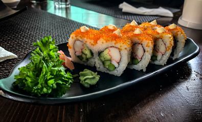 California Uramaki, A sushi dish with crabstick, prawn, sweet egg, asparagus and cucumber roll topped with tobiko