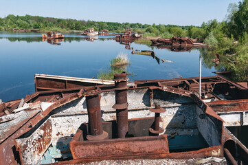 Plakat Abandoned sunken Barges Boats On River Pripyat in Chernobyl exclusion Zone. Chernobyl Nuclear Power Plant Zone of Alienation in Ukraine