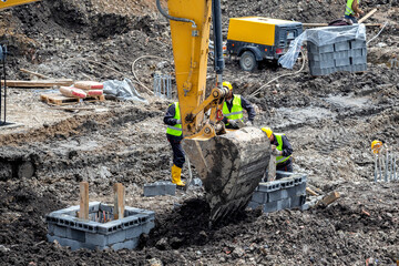 Work crews performs soil excavation work