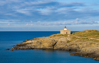 Fototapeta na wymiar Lighthouse Punta Sarnella in Port de la Selva, Costa Brava, Catalonia, Spain, Europe