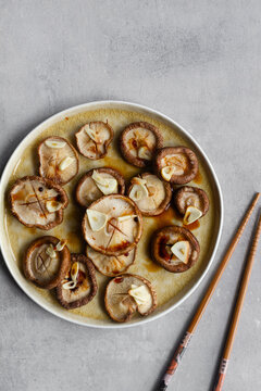 Delicious baked mushrooms with garlic poured with soy sauce