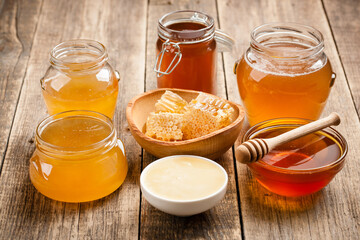 Various honey on wooden table