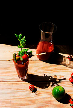 Virgin blood mary placed on a wooden table with black background