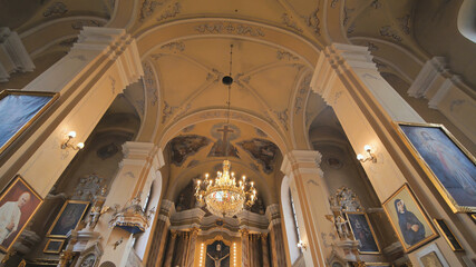 Fototapeta na wymiar The interior of the catholic church. Video on the move.
