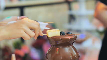 Fruit, berries prepared chocolate fountain. Wedding celebration.