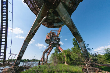 Abandoned dock cranes in Prypiat, Chernobyl exclusion Zone. Chernobyl Nuclear Power Plant Zone of...