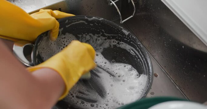 Woman wash dish in kitchen