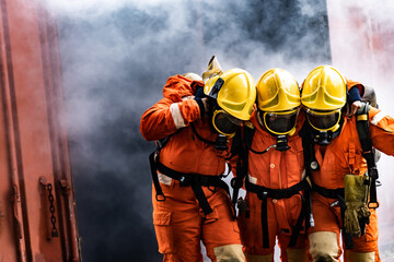 Firefighter rescue colleague from burning building - 364564849