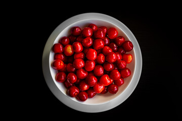 red cherries in a bowl