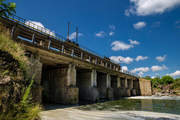 Fototapeta na wymiar Old hydroelectric station. The flow of water. Ukraine.