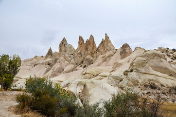 Photo of beautiful unique Mountain landscape with fairy chimneys in Goreme, Cappadocia, Turkey