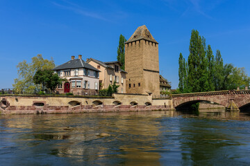 Canal side view of the historical part of Strasbourg. "Ponts Couverts" Bridge and "Hans von Altheimturm " Tower.