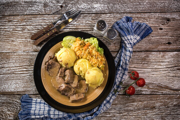 Braised pork tongues in horseradish sauce.