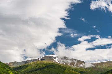 Sunlight falling on the Altai Mountains through the clouds