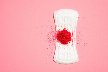 Soft white women's pad isolated on pink background. Close concept photography for a women's or...