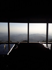 Landscape with mountains through the coffee shop in the afternoon