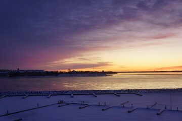 Sunset in winter over Kingston marina in Canada.