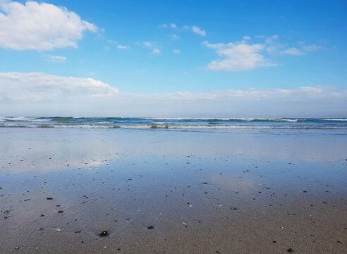 Reflective ocean and beach view 