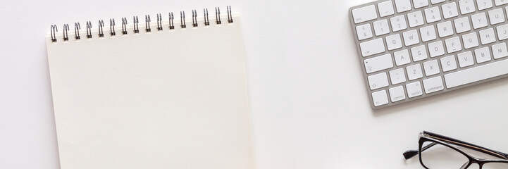 Sketchbook mockup. Keyboard on white background. Panorama.
