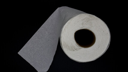 Toilet paper on black background. Aerial photography