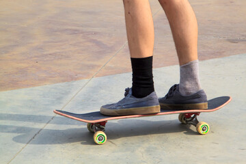 Young man practising on skateboard in skate park