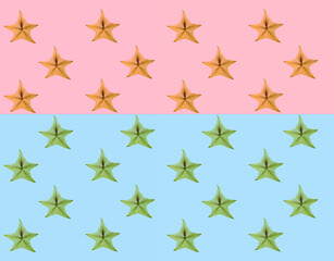 Pattern of fresh fruits slices on pastel background from top view.