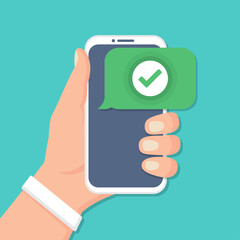 Hand holding smartphone with check icon in a flat design