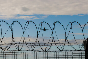 barbed wire fence, airplane