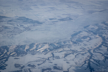 Aerial view of the snow covered mountains