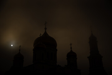 Foggy church at night
