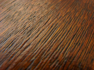 Fototapeta premium Wooden table close up - warm brown colors - texture