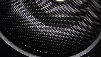 Closeup of pattern on a black speaker