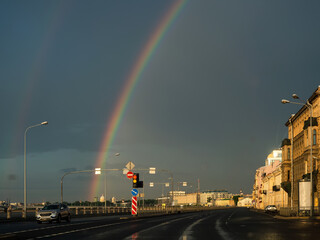 Morning rainbow over the embankment of St. Petersburg